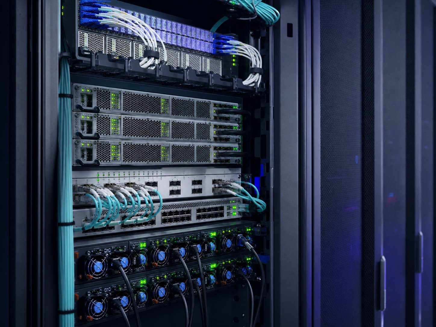 Network rack with redundant switches, organized fiber paths, and diagnostic status lights